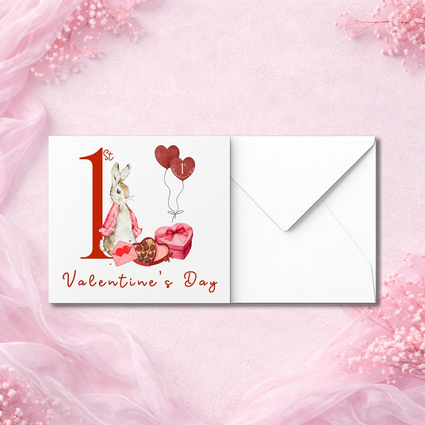 Adorable “1st Valentine’s Day” card with bunny illustration and gift imagery. Bunny wears a pink cape and sits beside chocolates and heart balloons. Red calligraphy font adds charm. Premium white cardstock and envelope included. Pictured flat with soft baby-pink decor. Ideal for new parents celebrating baby’s first Valentine milestone. Gender-neutral design.