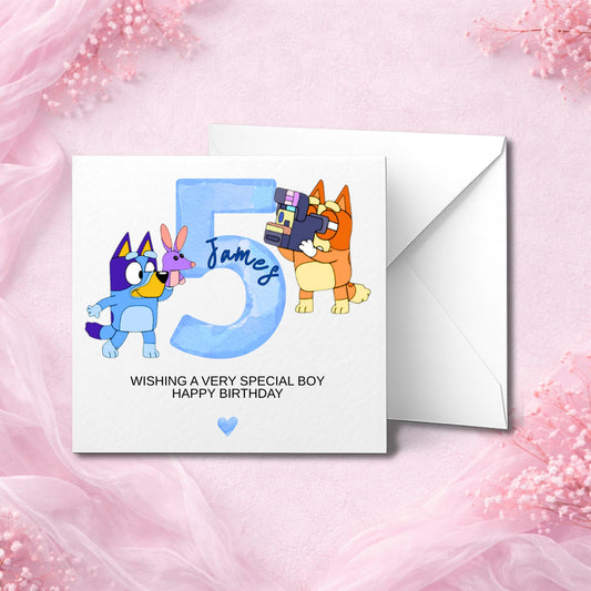 Personalised 5th birthday card featuring cute cartoon dogs inspired by Bluey and Bingo, with child’s name and age.